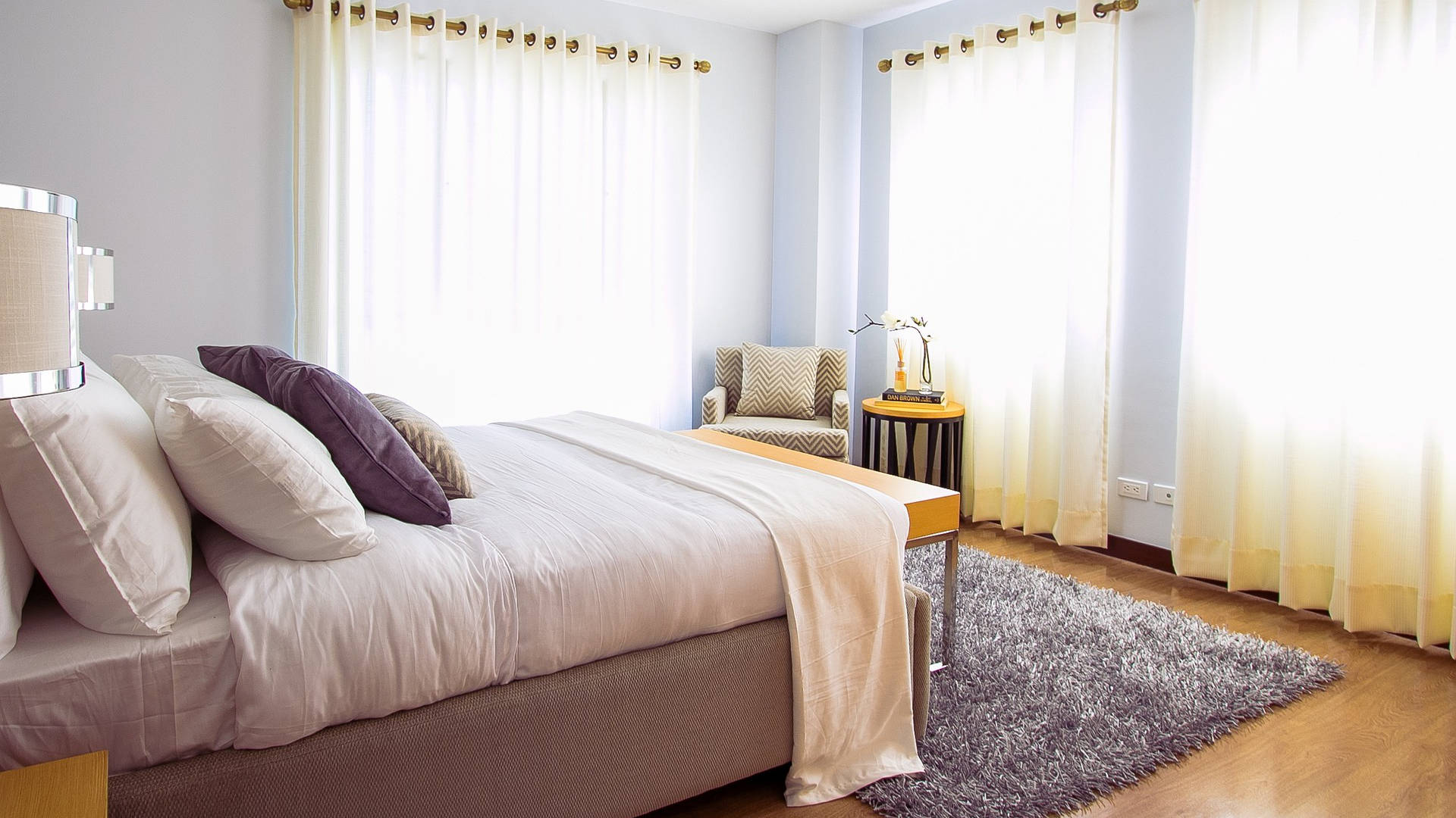Bedroom with curtains during the day