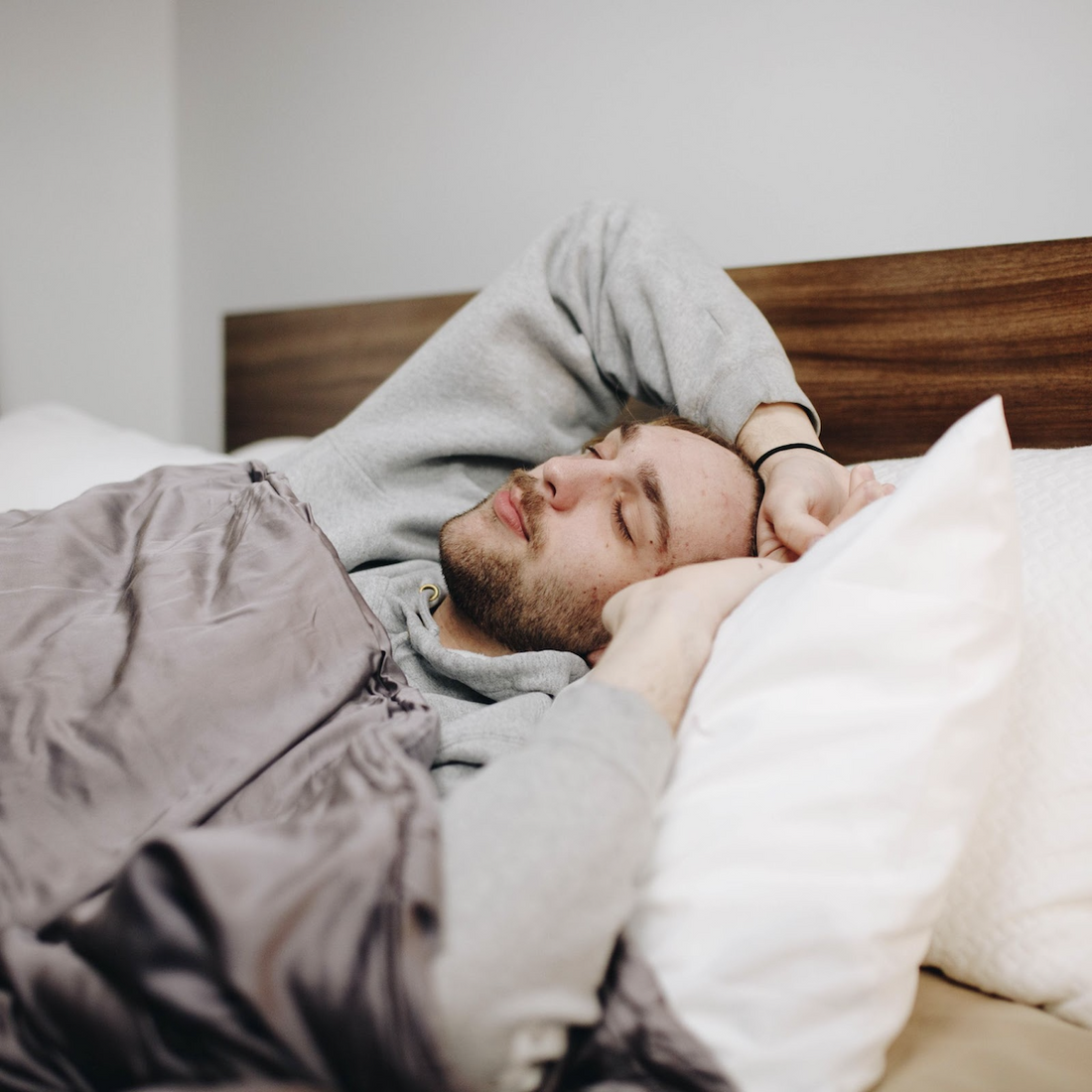 how to train yourself to sleep on your back: man sleeping