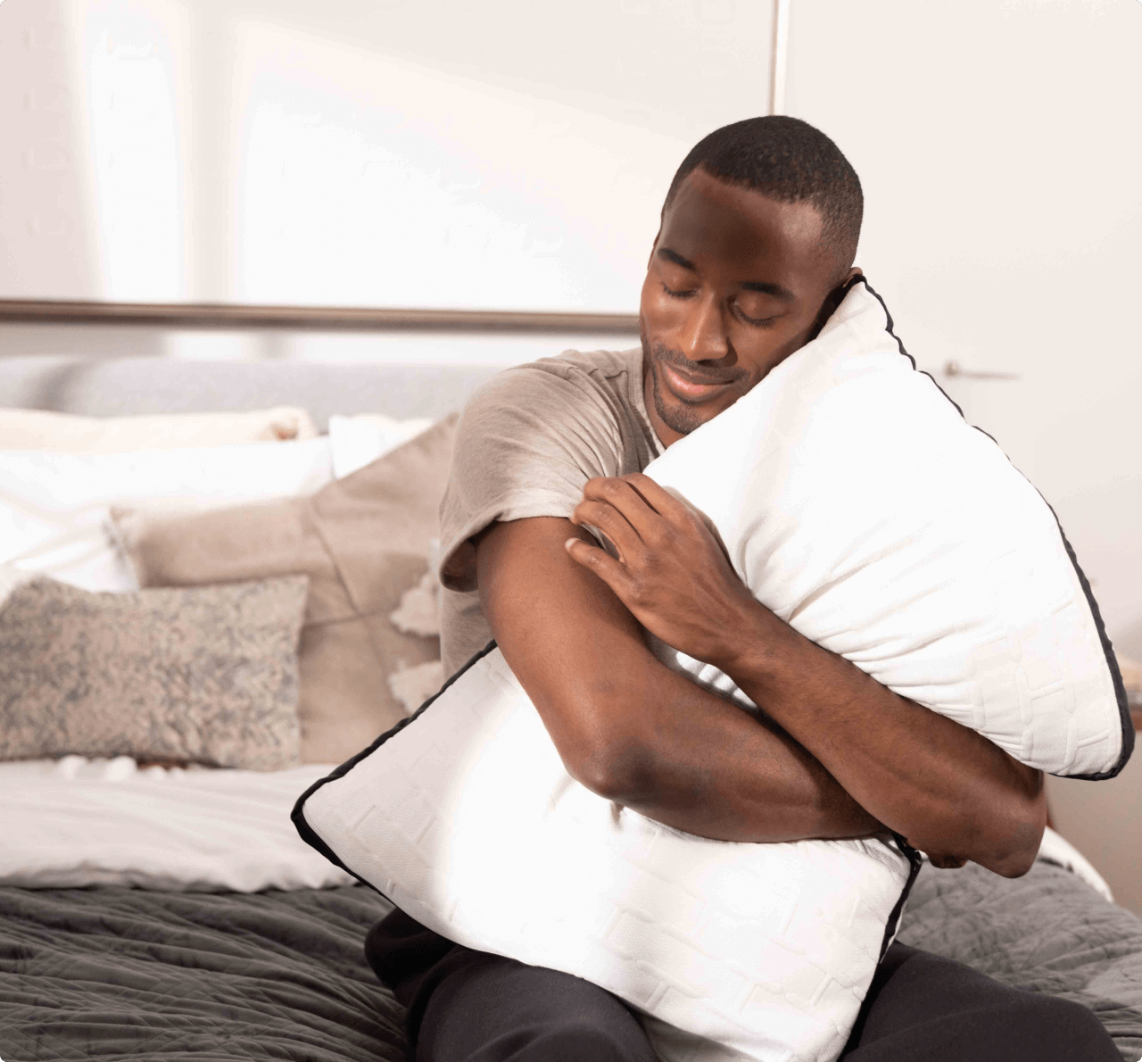 man hugging hybrid pillow