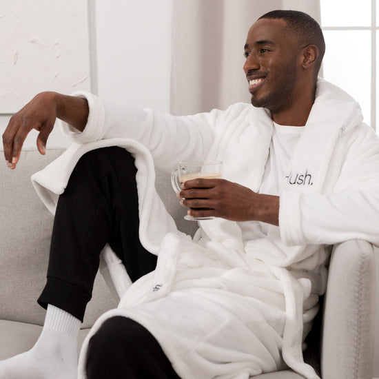 Man sitting on couch wearing Hush Robe