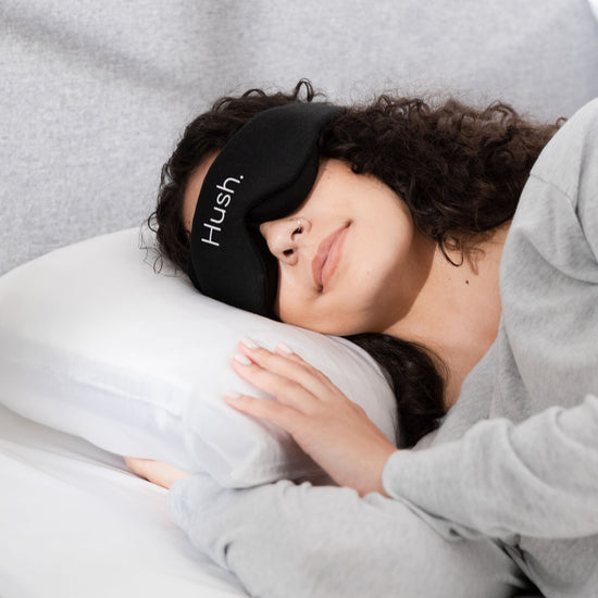 Woman sleeping with Hush Blackout Eye Mask